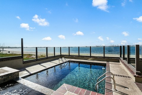 Swim in the private pool with uninterrupted views across Mission Bay