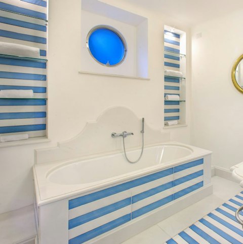 Soak in the tub after a busy day discovering the Amalfi coast
