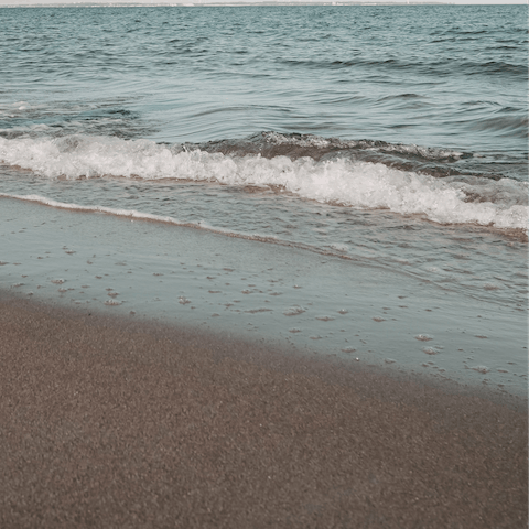 Go for a romantic stroll on Mikri Ammos, a two-minute drive away