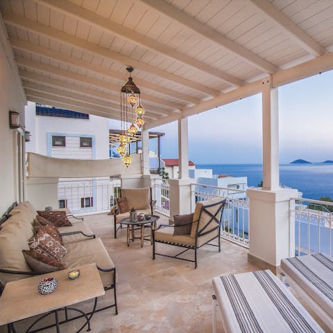 Sit out on the private balcony and enjoy a drink along with stunning sea views
