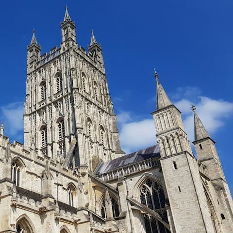 Drive thirteen minutes to admire the majesty of Gloucester Cathedral