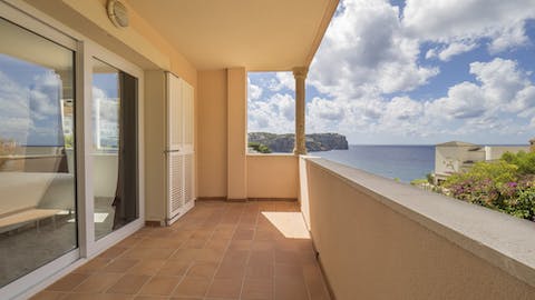 Sip cocktails on the balcony and take in the glorious coastal views