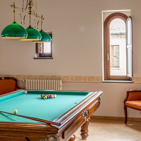 Rack up a game of pool on the full-sized table in the games room