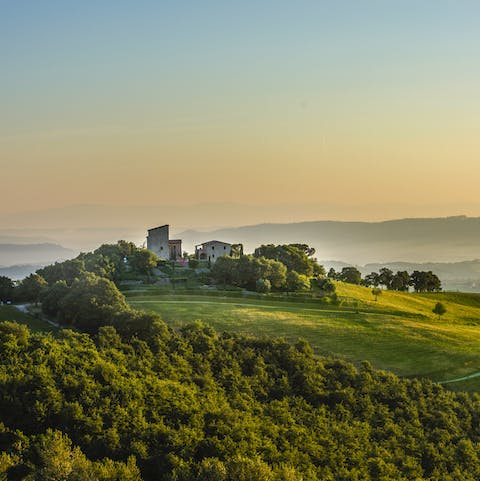 Stay in a 13th-century tower house surrounded by the undulating Umbrian landscape