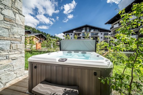 Soak away tired legs in your private alpine hot tub