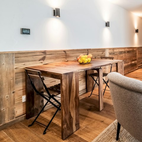 Pull up a chair at the wooden dining table for post-adventure meals