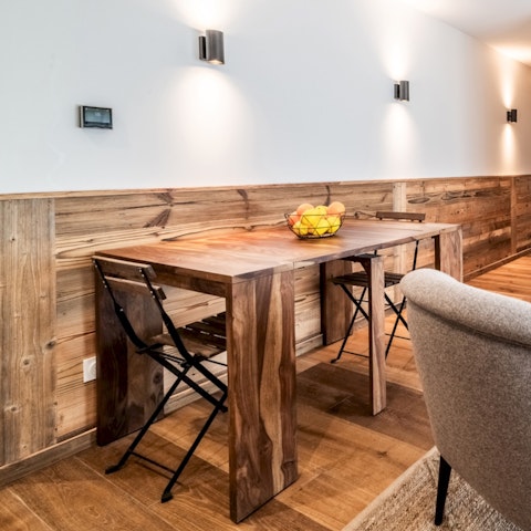 Pull up a chair at the wooden dining table for post-adventure meals