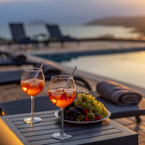 Enjoy a sundown tipple & snack by the pool