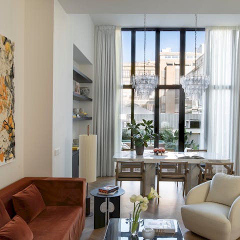 Watch the sun set over the city out through the huge window in the living area