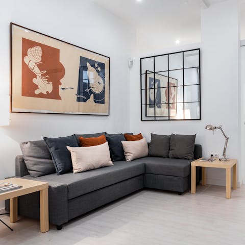 Kick back in the stylish living area with a glass of Spanish wine after a day of exploring the city on foot