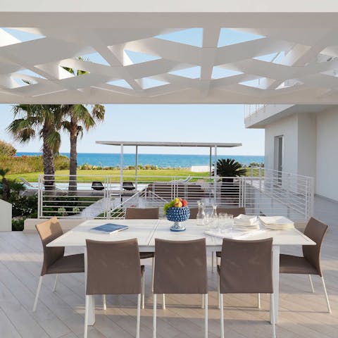 Admire the sea views while dining alfresco