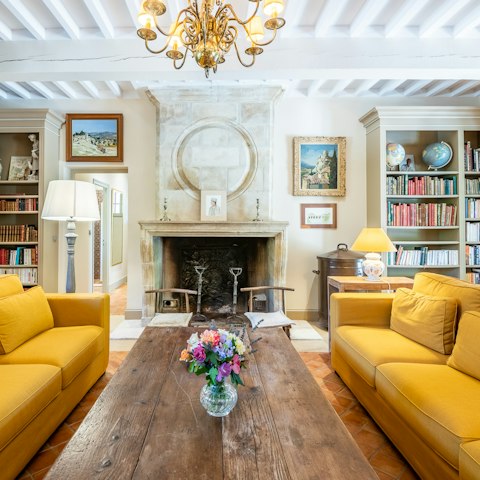 Sit next to the Provençal fireplace and read a book