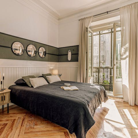 Wake up to sunlight streaming through floor-to-ceiling windows