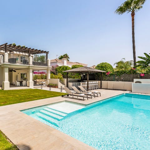 Plunge head-first into the crystaline waters of the private pool