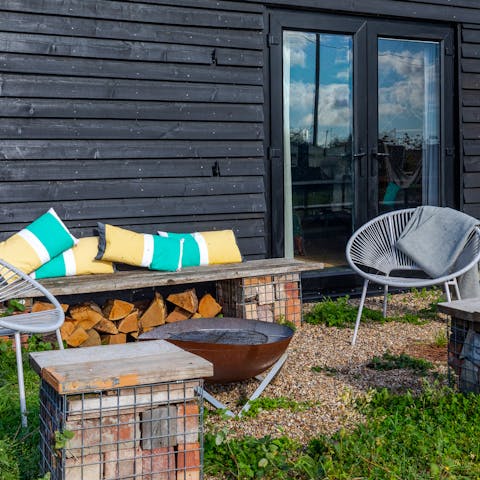 Gather round the fire pit as the sun starts to set