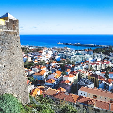 Explore Funchal, a ten-minute drive away