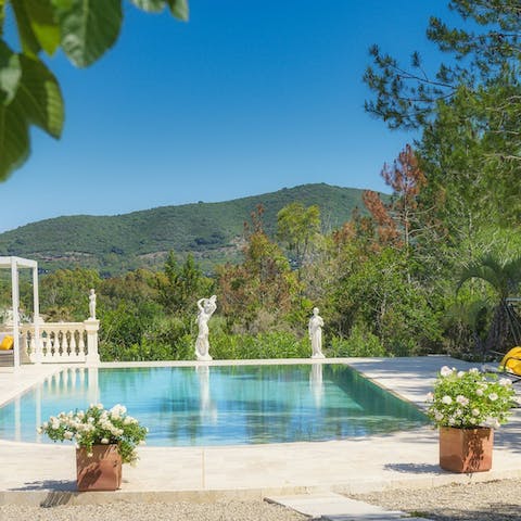Cool off in the statue-lined private pool