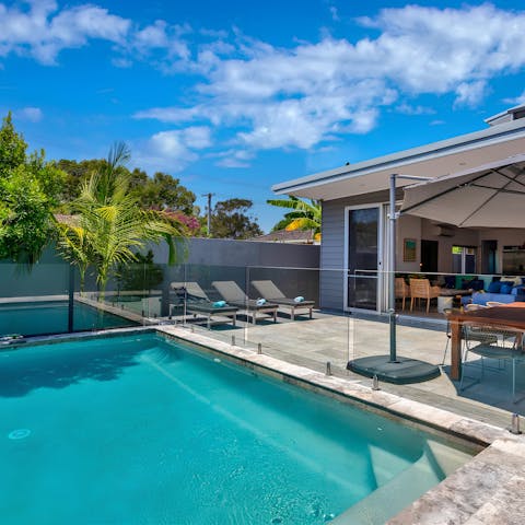 Spend sunny days splashing in the saltwater pool