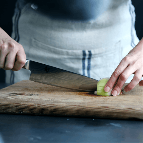 Hire a private chef to come and cook salmon en papillote for your family