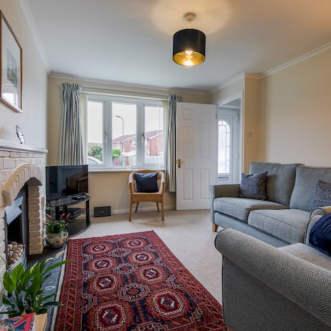 Unwind with a movie by the toasty fireplace