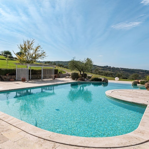 Swim in the communal pool to beat the Tuscan heat