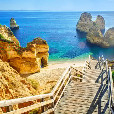 Spend days on the golden sands of Praia de Armação de Pêra