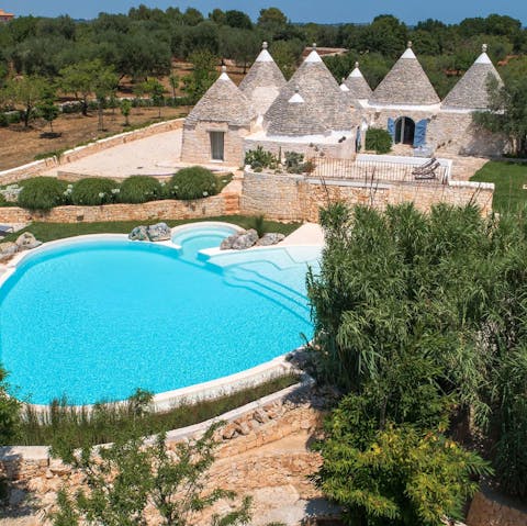 Lounge beneath cloudless skies beside the saltwater pool