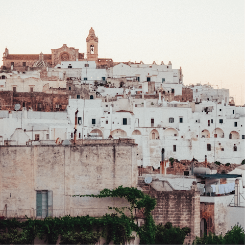 Visit the picturesque whitewashed hilltop town of Ostuni, a short drive away