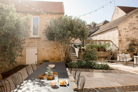 Linger over breakfast in the sun-filled stone courtyard