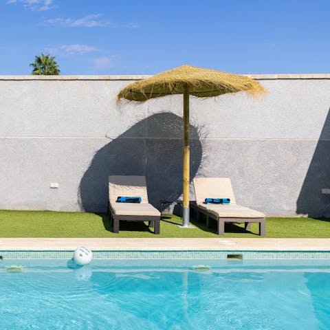 Sprawl out on a poolside lounger for a siesta in the sun