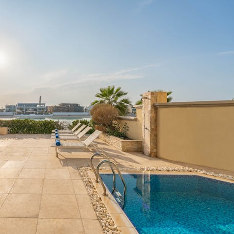 Cool off with a dip in the private pool or pad over the beach