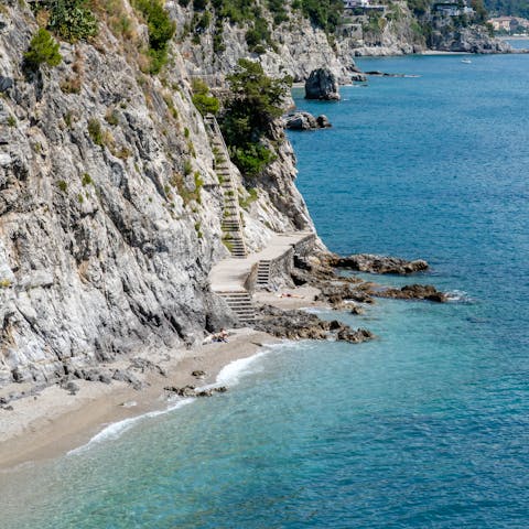 Splash in the shallows of the beach below