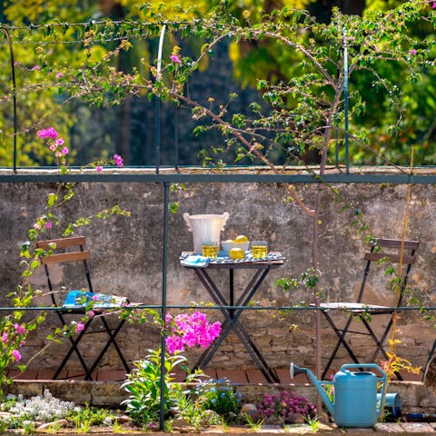Find an idyllic spot on the terrace to gaze across the Royal Alcázar gardens
