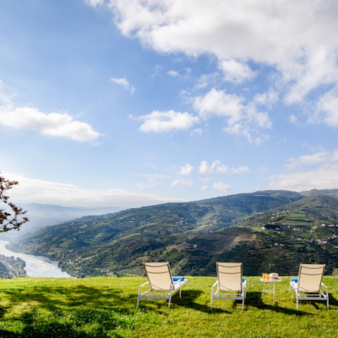 Pour a glass of your favourite drink and watch the sunset from a lounger