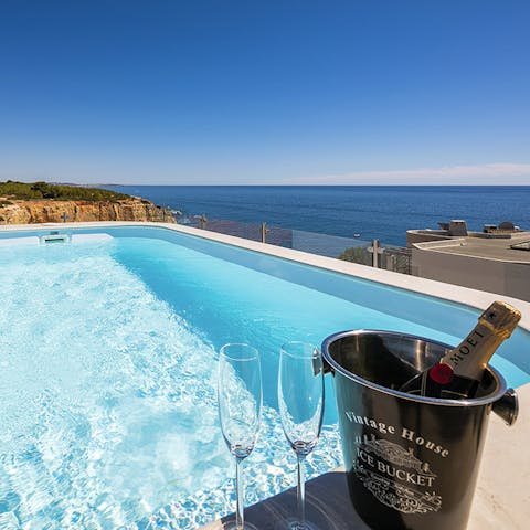 Soak in the cool waters of the private pool as you gaze out at the sea