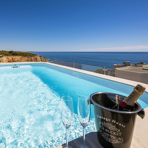 Soak in the cool waters of the private pool as you gaze out at the sea