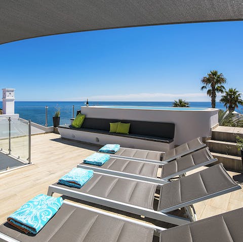 Soak up the sun in absolute peace on the contemporary roof terrace