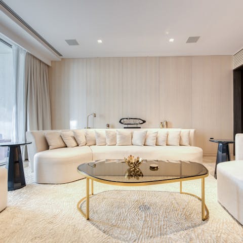 Relax in the plush living area after a day of exploring the city