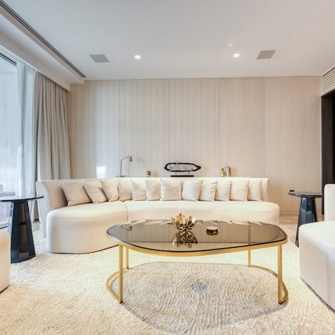 Relax in the plush living area after a day of exploring the city