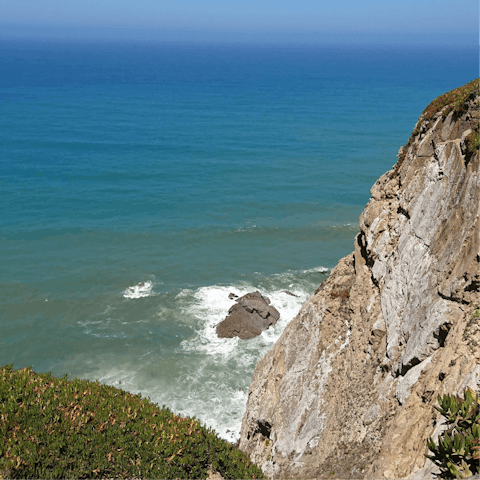 Swim in the sea at Praia da Adraga – it's a short drive away