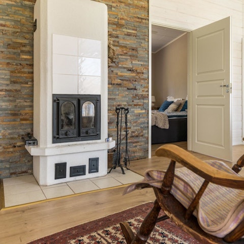 Warm up by the home's log-burning fire