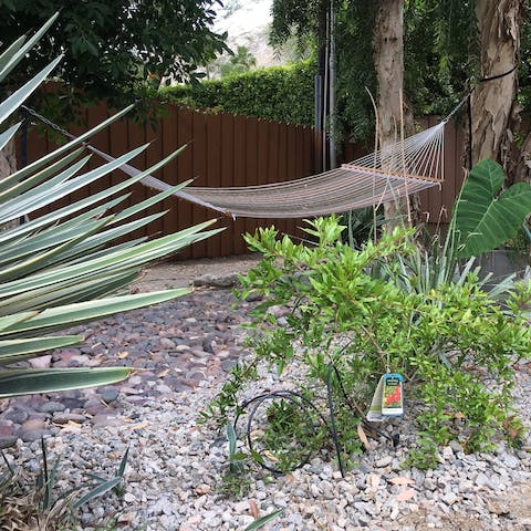 Enjoy a peaceful moment in the backyard hammock