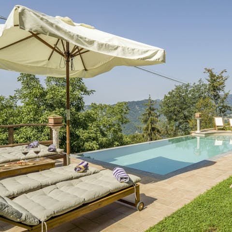 Admire the countryside views from the private pool