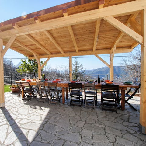 Serve alfresco meals prepared in the outdoor kitchen