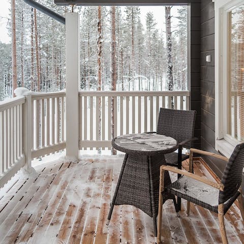 Brave a cup of coffee on the home's balcony