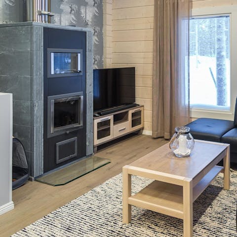 Warm up by the large fireplace in the living room