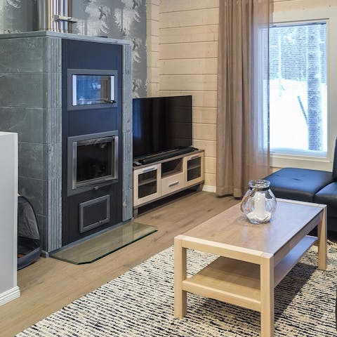 Warm up by the large fireplace in the living room