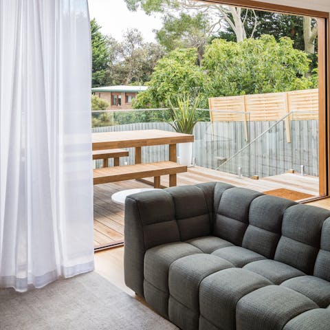 Open the bi-fold doors to blend the indoor and outdoor living spaces