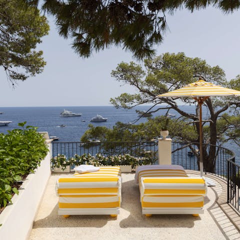 Soak up the sun and admire the sea views from the terrace