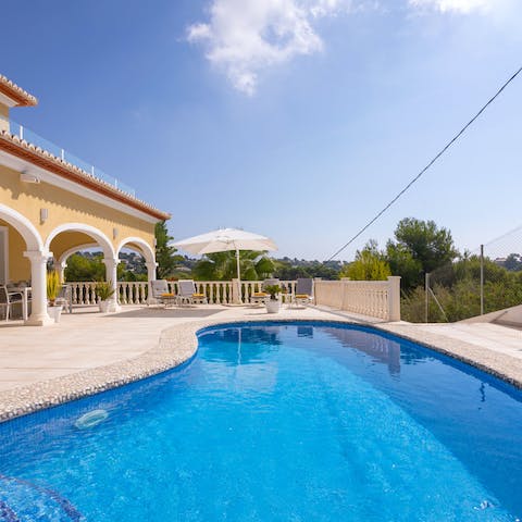 Cool off with a dip in the kidney-shaped pool or just relax by the water with a good book